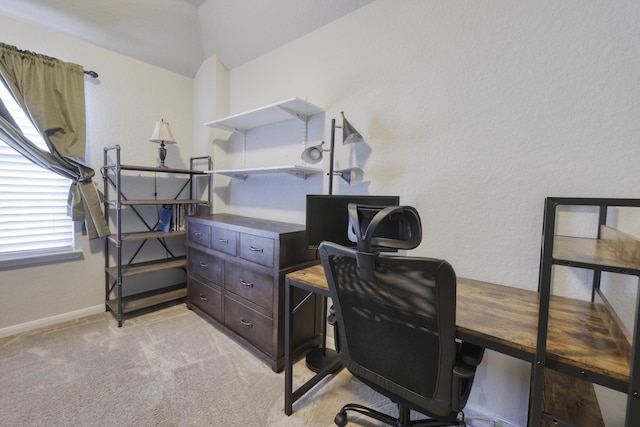 home office featuring light carpet and baseboards