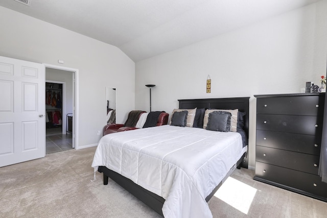 bedroom with lofted ceiling, carpet, visible vents, and baseboards