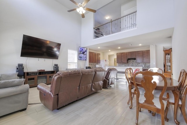 living area with a ceiling fan