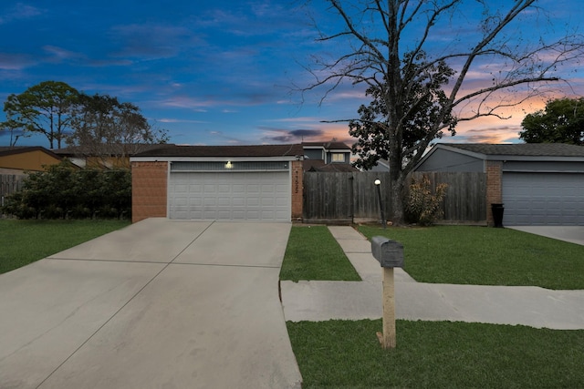 ranch-style home featuring a lawn