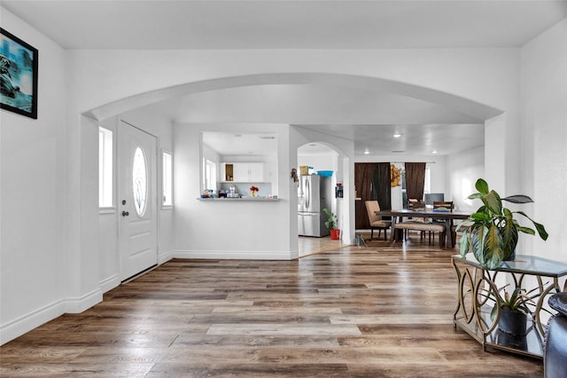 foyer entrance with wood-type flooring