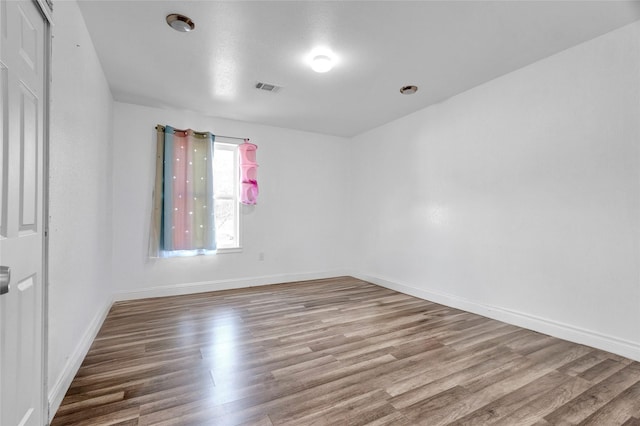 empty room featuring hardwood / wood-style floors