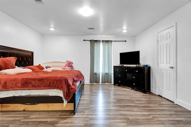 bedroom featuring hardwood / wood-style flooring