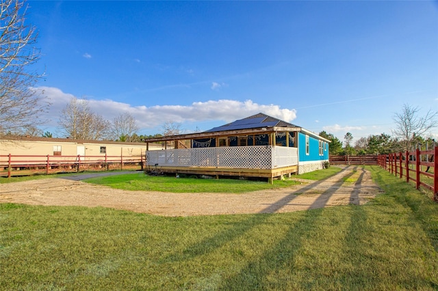 rear view of house with a yard