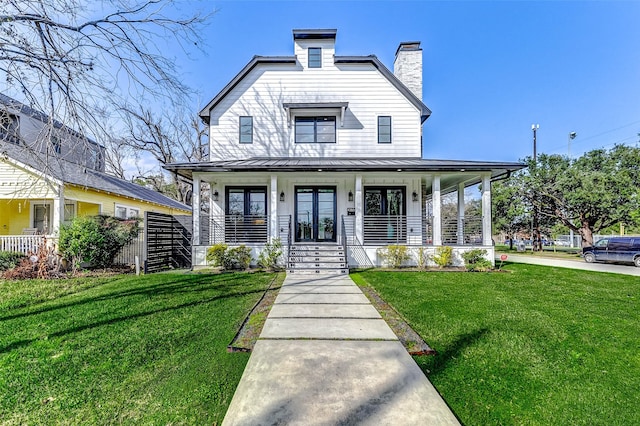 view of front of house featuring a front yard and covered porch