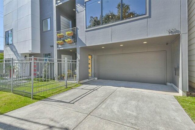 view of front of property with a garage and a front yard