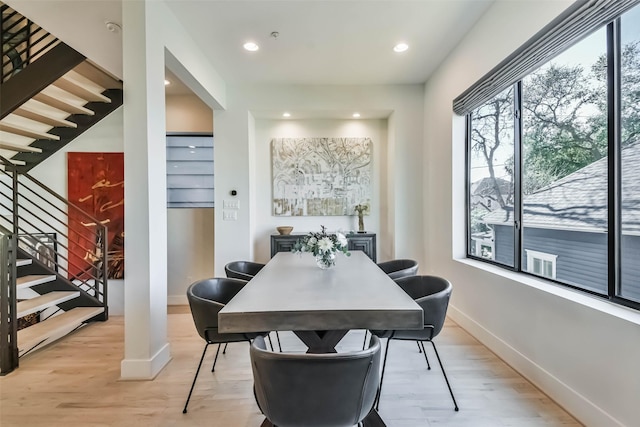 dining room with light hardwood / wood-style flooring