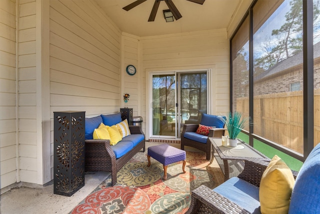 sunroom featuring ceiling fan