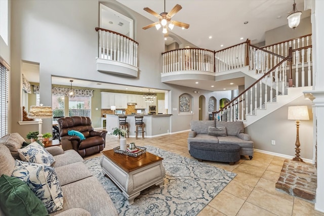 tiled living room featuring ceiling fan