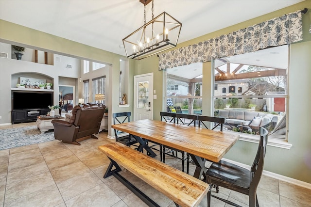 tiled dining space with plenty of natural light and built in shelves