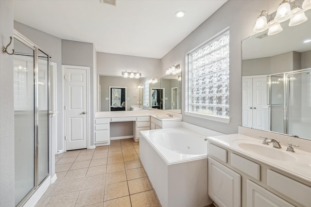 bathroom with plus walk in shower, tile patterned floors, and vanity