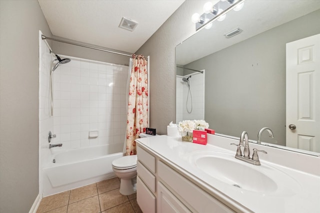 full bathroom with tile patterned floors, toilet, shower / tub combo, and vanity