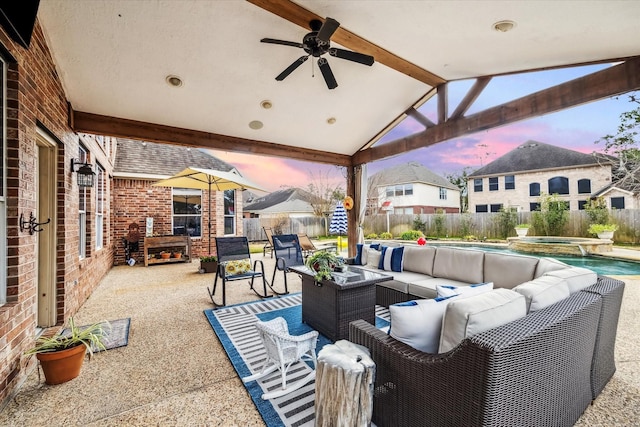 patio terrace at dusk with a fenced in pool, an outdoor hangout area, and ceiling fan