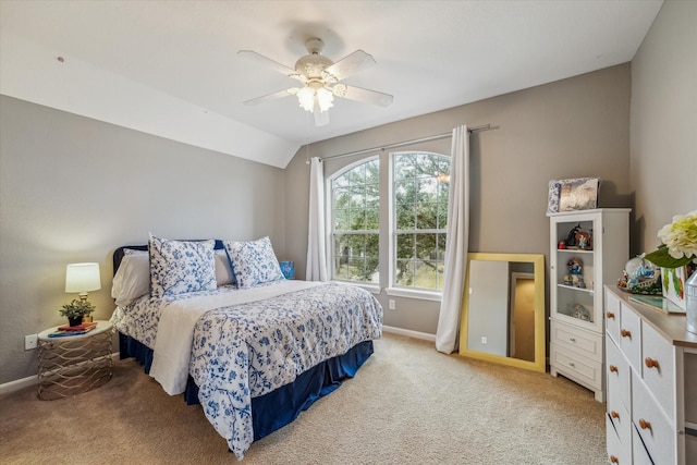 carpeted bedroom featuring ceiling fan and lofted ceiling