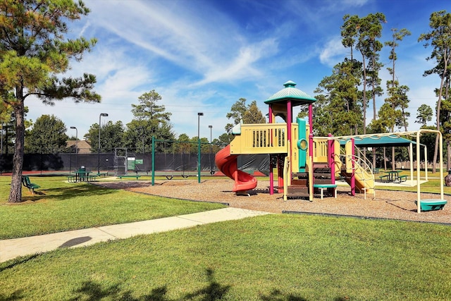 view of jungle gym featuring a yard