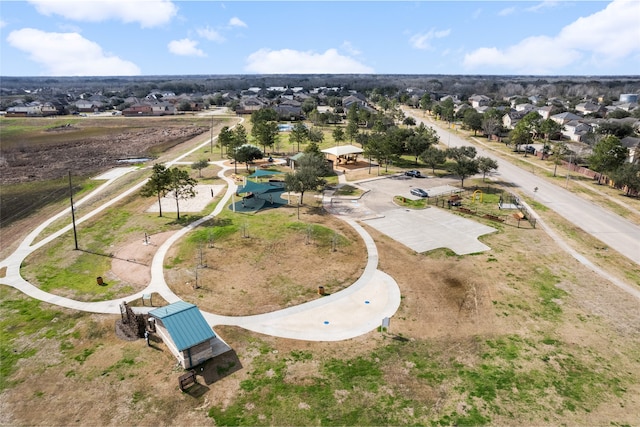 birds eye view of property with a residential view