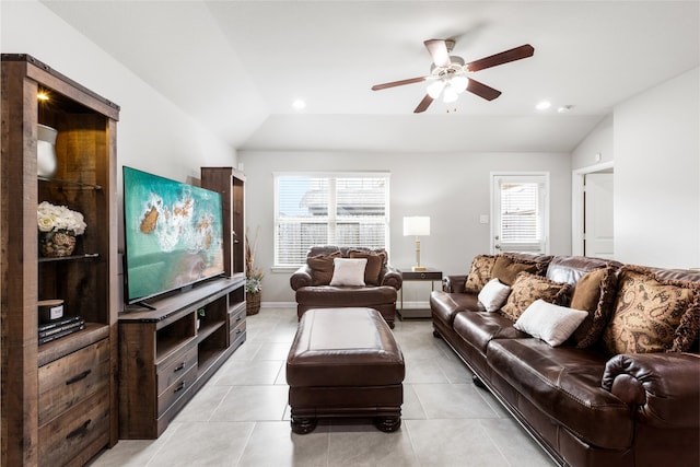 living room with vaulted ceiling, light tile patterned floors, and plenty of natural light