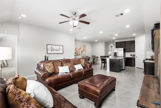 living room featuring recessed lighting, visible vents, ceiling fan, and lofted ceiling