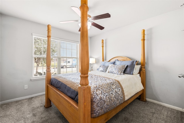 carpeted bedroom with ceiling fan and baseboards