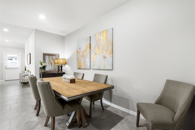 dining area featuring recessed lighting, baseboards, and tile patterned floors