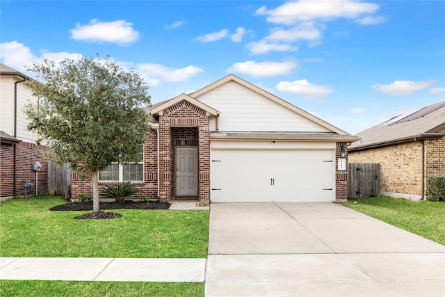 view of front of house with a garage, brick siding, and a front lawn