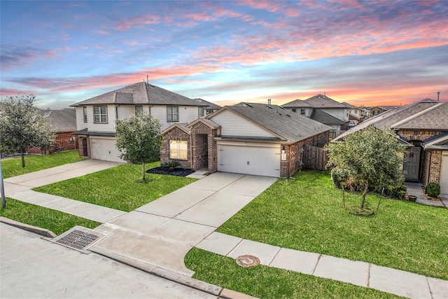 traditional-style house with a front yard, fence, and driveway