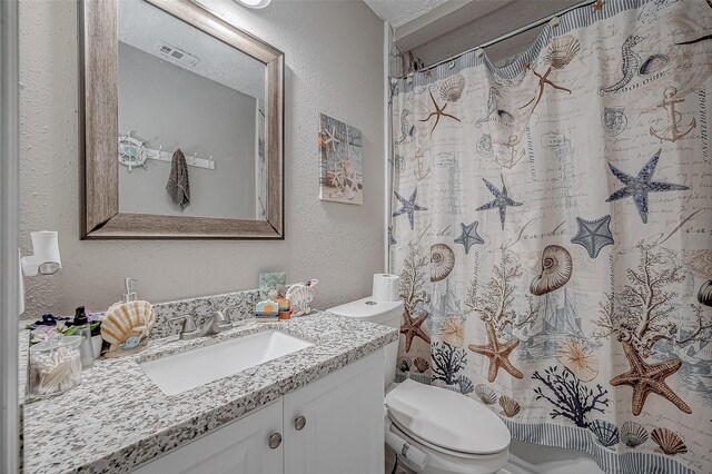 full bathroom with visible vents, a textured wall, toilet, vanity, and a shower with curtain