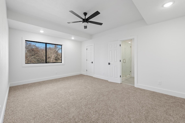 unfurnished bedroom with light carpet and connected bathroom