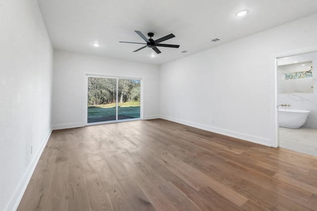 empty room featuring light hardwood / wood-style floors and ceiling fan