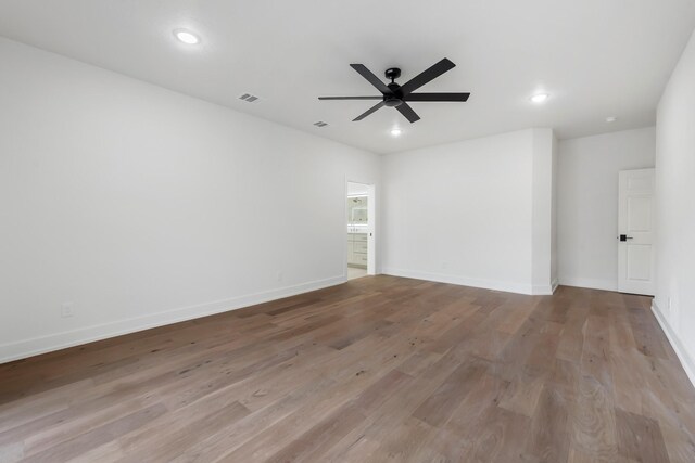 empty room featuring light hardwood / wood-style flooring and ceiling fan