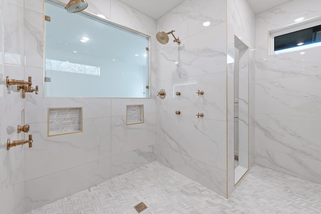 bathroom featuring a tile shower