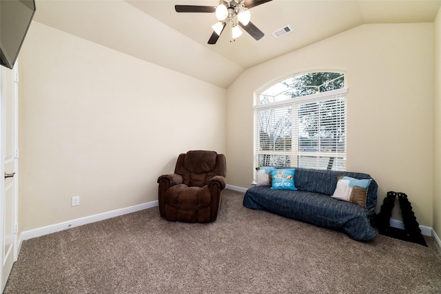 sitting room with vaulted ceiling, carpet flooring, and ceiling fan