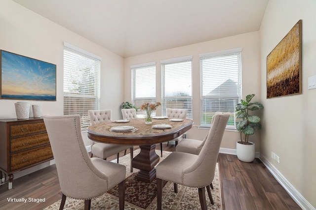 dining space with dark wood-style floors and baseboards