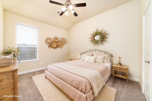 carpeted bedroom with ceiling fan, visible vents, baseboards, and vaulted ceiling