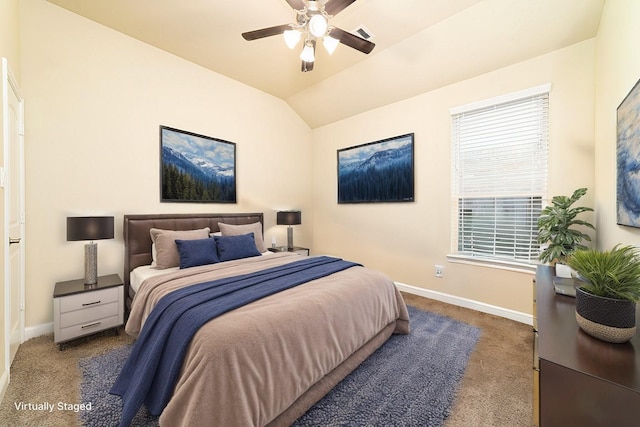 bedroom with carpet floors, visible vents, baseboards, and vaulted ceiling