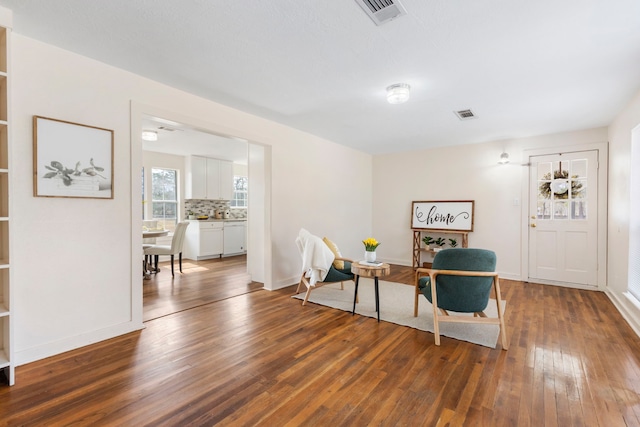 sitting room featuring dark hardwood / wood-style floors