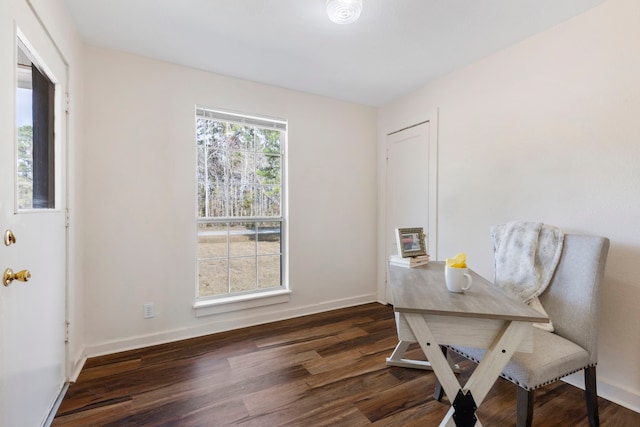 office space with dark wood-type flooring