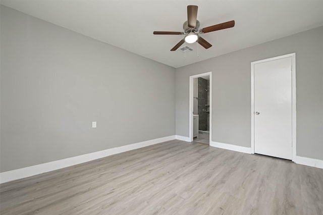 unfurnished bedroom with ceiling fan, light wood-type flooring, and ensuite bath