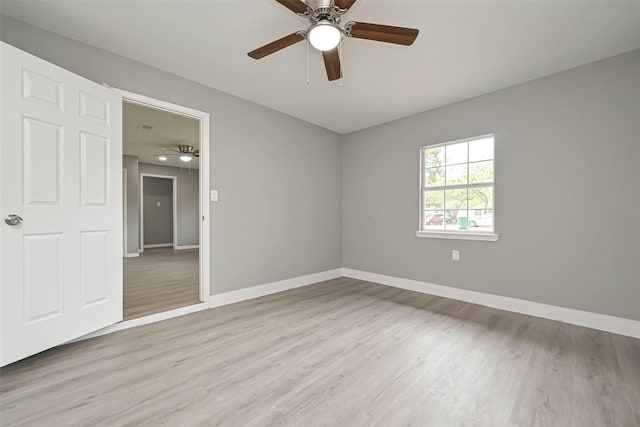 unfurnished room featuring light hardwood / wood-style floors and ceiling fan