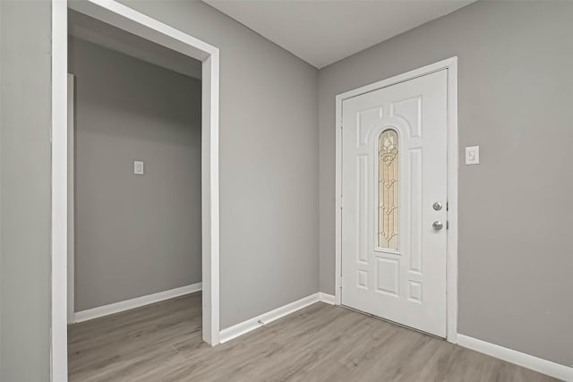 foyer entrance with light hardwood / wood-style flooring