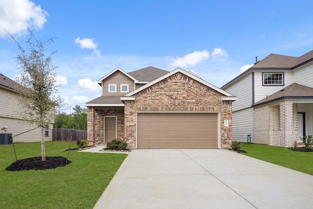 2331 E Chunk Dr, Conroe, TX 77301 - view of front of home featuring an attached garage, brick siding, a front lawn, driveway, and roof with shingles