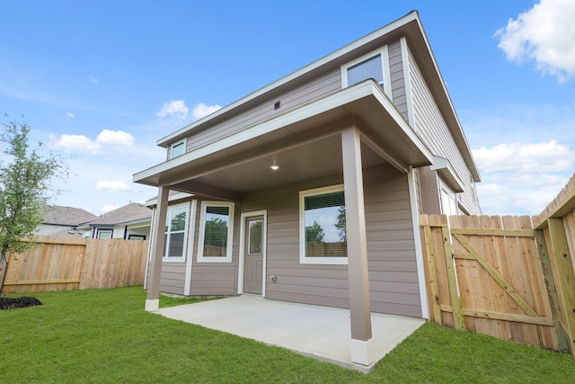 2331 E Chunk Dr, Conroe, TX 77301 - rear view of house with a patio, a yard, fence, and a gate