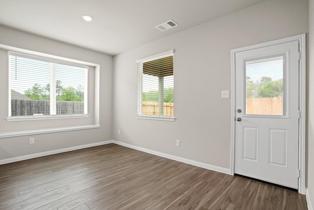 2331 E Chunk Dr, Conroe, TX 77301 - interior space featuring wood finished floors, visible vents, and plenty of natural light