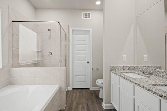 2331 E Chunk Dr, Conroe, TX 77301 - full bath with a stall shower, a bath, visible vents, a sink, and wood finished floors