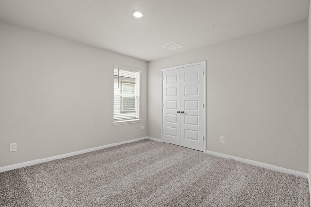 2331 E Chunk Dr, Conroe, TX 77301 - unfurnished bedroom featuring a closet, visible vents, baseboards, and carpet