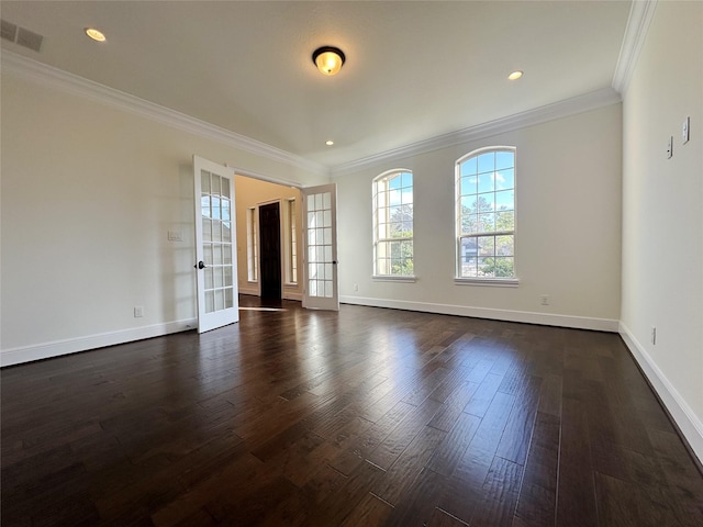 unfurnished room featuring ornamental molding, dark hardwood / wood-style flooring, and french doors