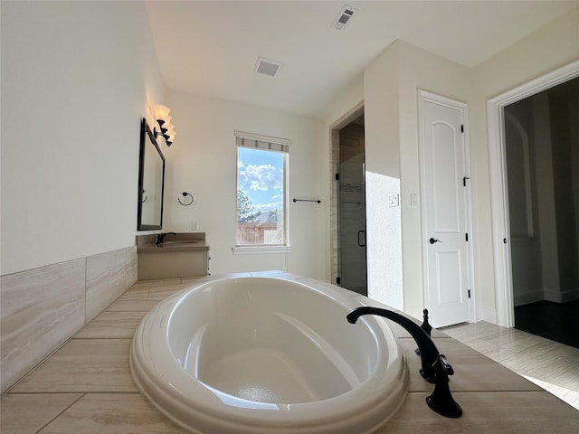 bathroom with vanity and plus walk in shower