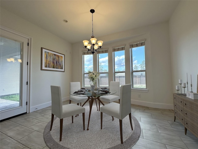 dining space with a notable chandelier