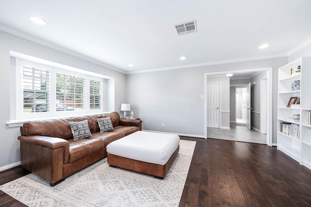 living room with crown molding and hardwood / wood-style flooring