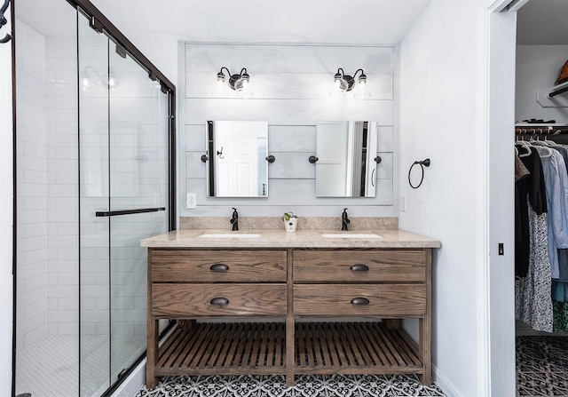 bathroom with vanity and an enclosed shower